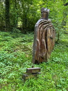 wooden statue in woods
