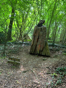 wooden statue in woods